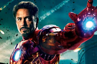 Robert Downey Jr. as Iron-Man holding his hand out to use a repulsor