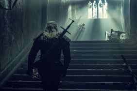 The Witcher walking up a flight of stairs