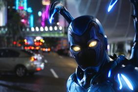 Blue Beetle standing in the street