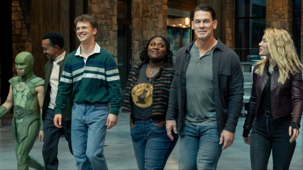 John Cena and a crew walk in a line.