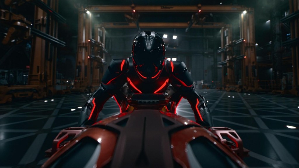 A person rides a motorcyle in Tron Legacy.
