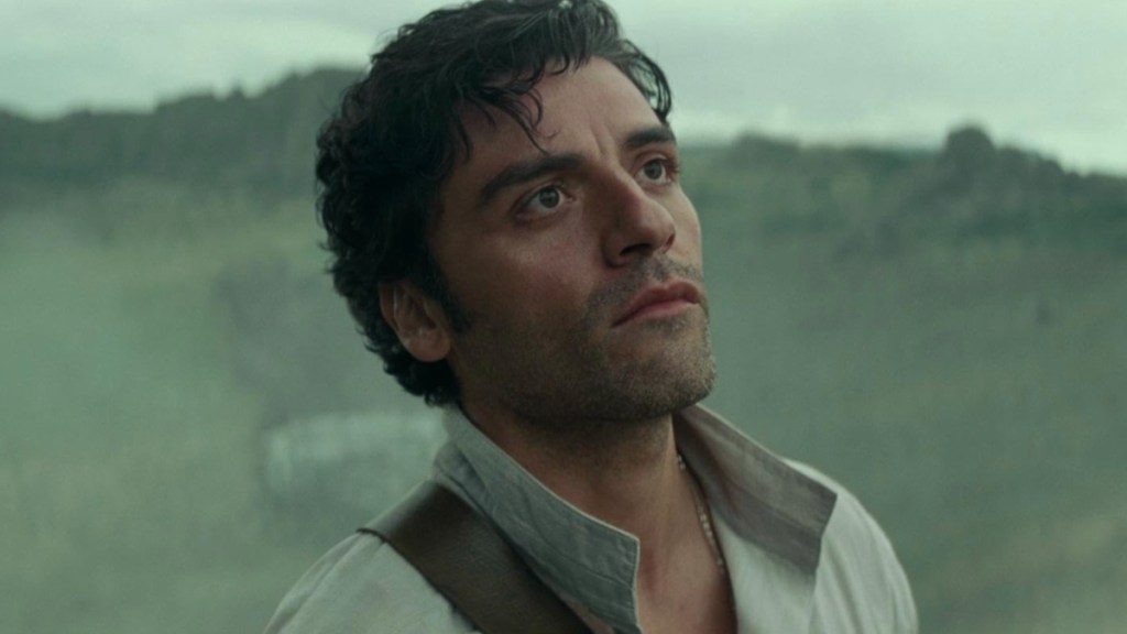 Oscar Isaac looks up and stares.