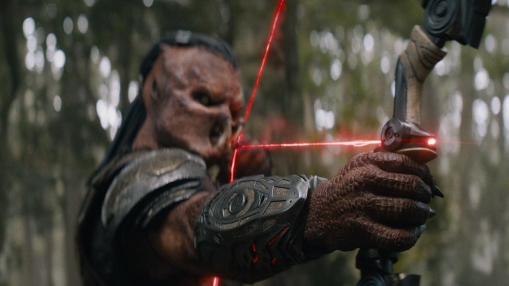 A creature draws an arrow in Predator: Badlands.