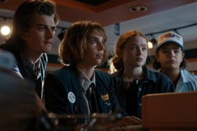 A group of kids look at a computer in Stranger Things.