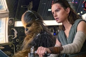 Rey sits with Chewbacca in The Last Jedi.