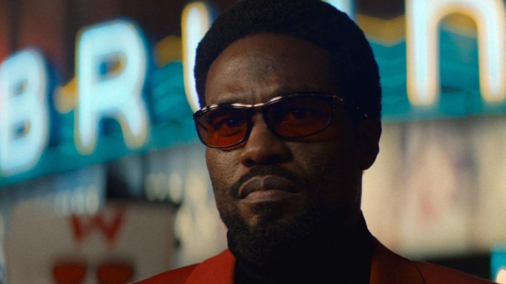 A man with sunglasses on stares in Wonder Man.