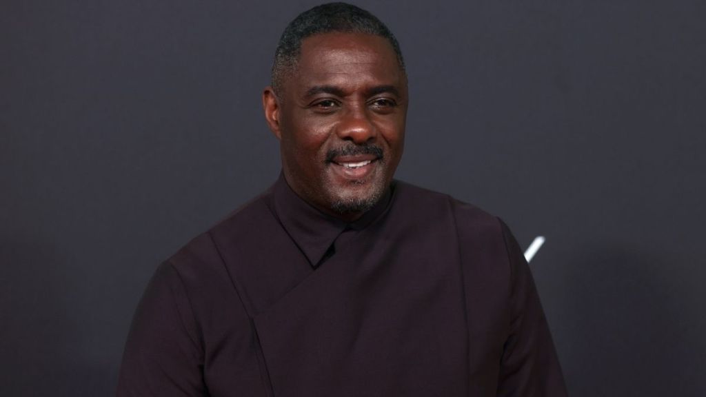 Idris Elba Poses With James Bond Actor Statues & We All Know Why