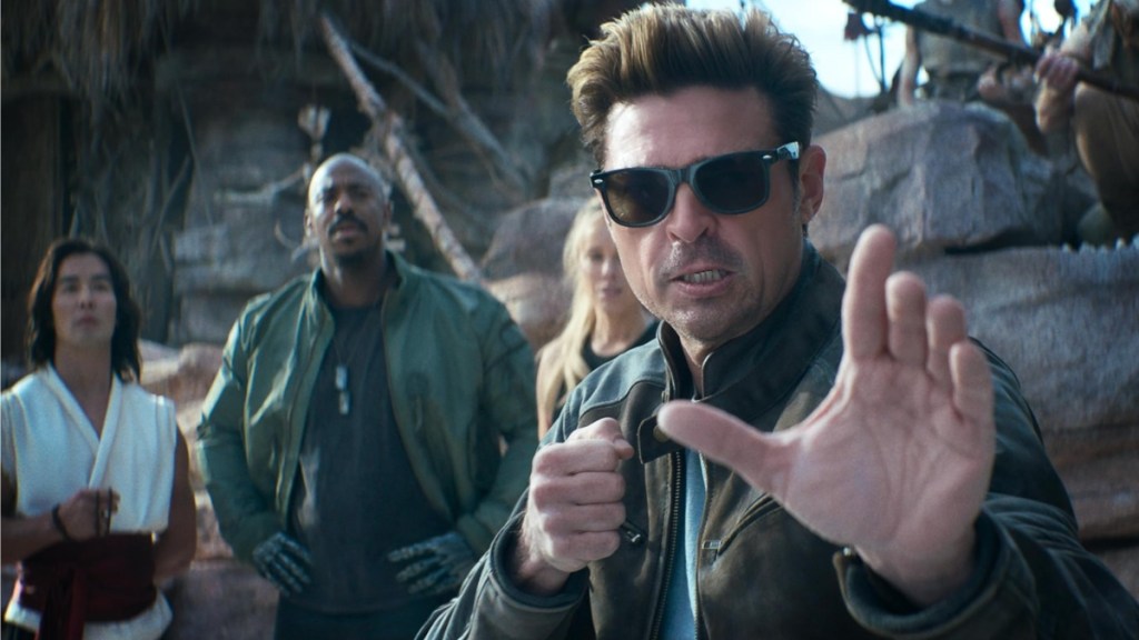 Karl Urban puts his hand up as Johnny Cage in Mortal Kombat II.