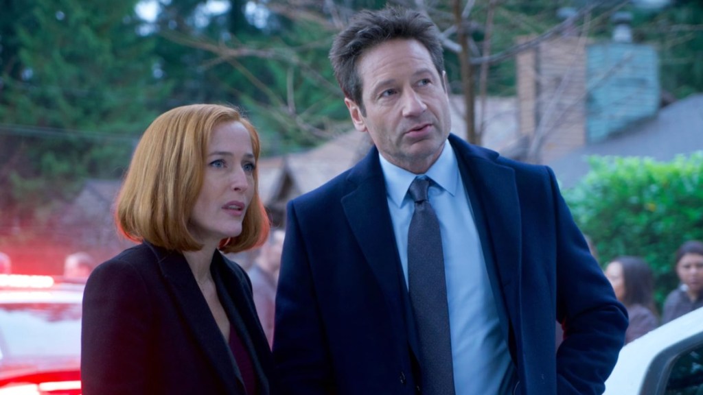 Mulder and Scully stand in The X-Files.