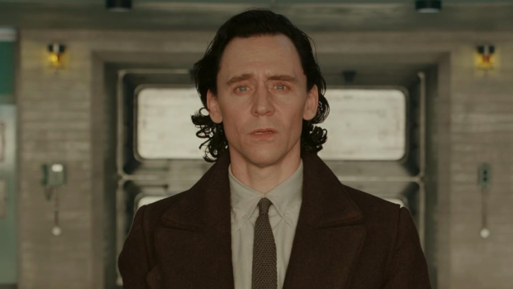Tom Hiddleston stares as Loki.