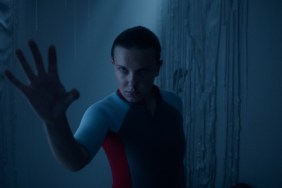 Millie Bobby Brown sticks hand out on Stranger Things.