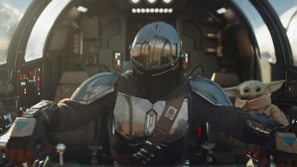 Mando and Grogu in a ship in The Mandalorian and Grogu.