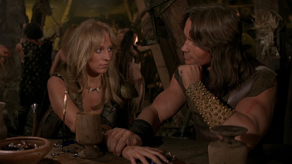 Conan the Barbarian and Valeria in a romantic moment