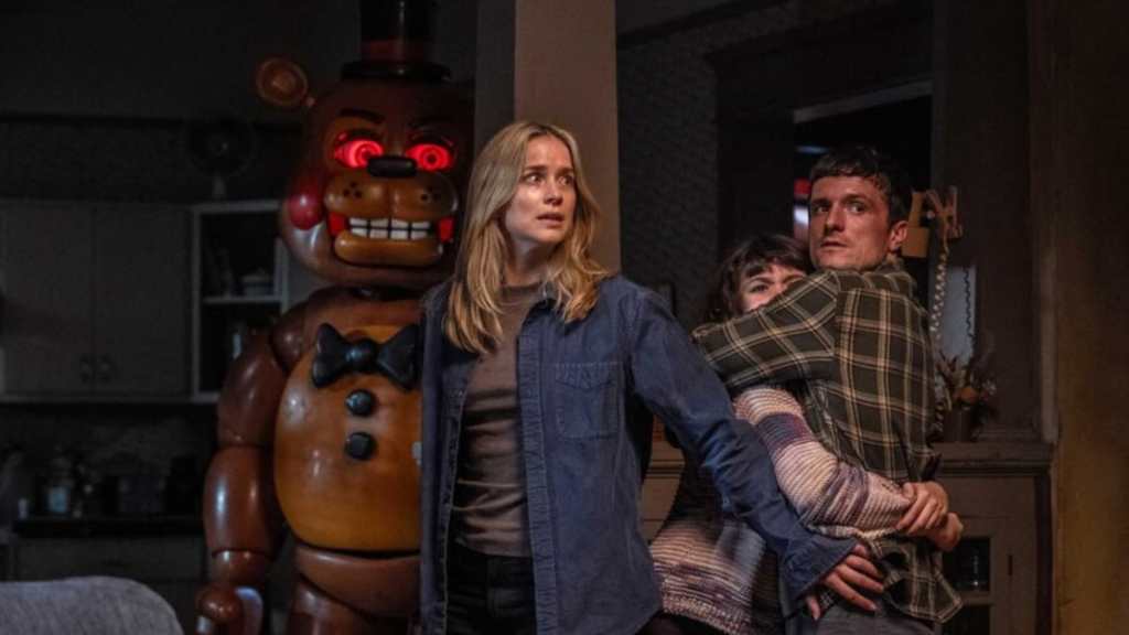 A group of people hold each other back in Five Nights at Freddy's 2.