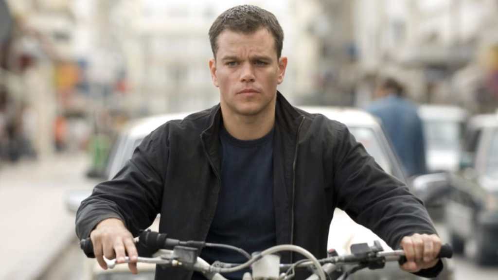 Matt Damon rides a motorcyle in The Bourne Ultimatum.