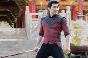 Simu Liu holds a weapon in Shang-Chi.
