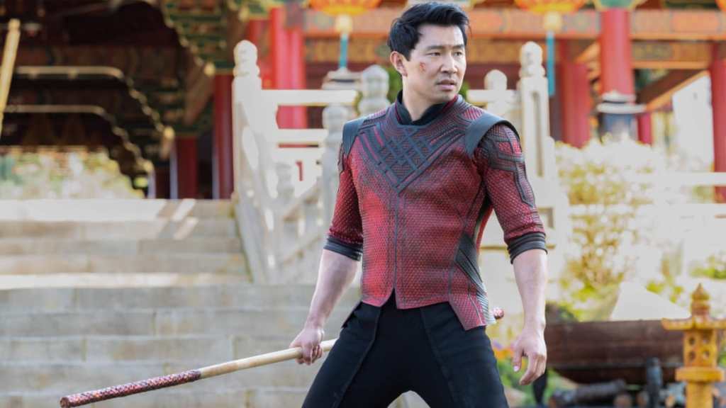 Simu Liu holds a weapon in Shang-Chi.