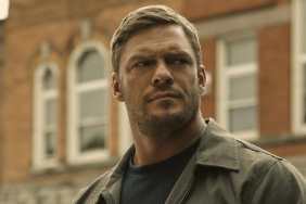 Alan Ritchson stares as Reacher.