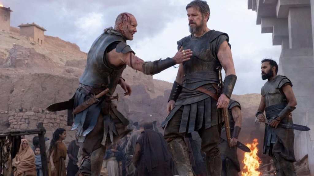 Matt Damon walks by a soldier in The Odyssey.