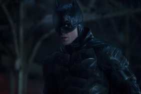 Robert Pattinson stares as The Batman.