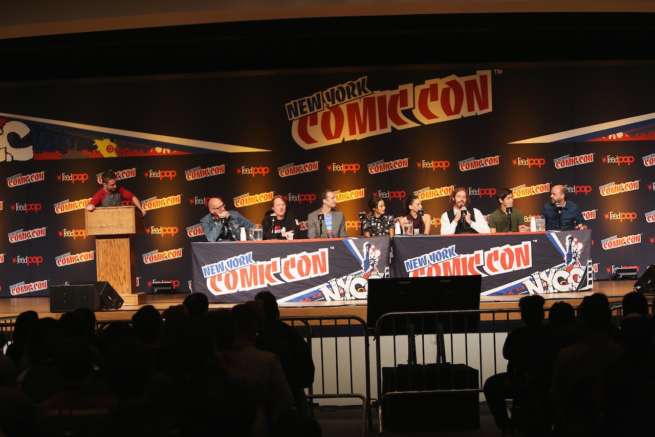 NEW YORK, NY - OCTOBER 09:  (L-R) Panel host Chris Hardwick, producer Roy Conli, director Don Hall, director Chris Williams, and actors Jamie Chung, Genesis Rodriguez, T.J. Miller, Ryan Potter, and Scott Adsit attend Walt Disney Studios' 2014 New York Comic Con presentation of "Big Hero 6" at the Javits Convention Center on Thursday October 9, 2014 in New York City.  (Photo by Jason Carter Rinaldi/Getty Images for Disney) *** Local Caption *** Chris Hardwick;Roy Conli;Don Hall;Chris Williams;Jamie Chung;Genesis Rodriguez;TJ Miller;Ryan Potter;Scott Adsit