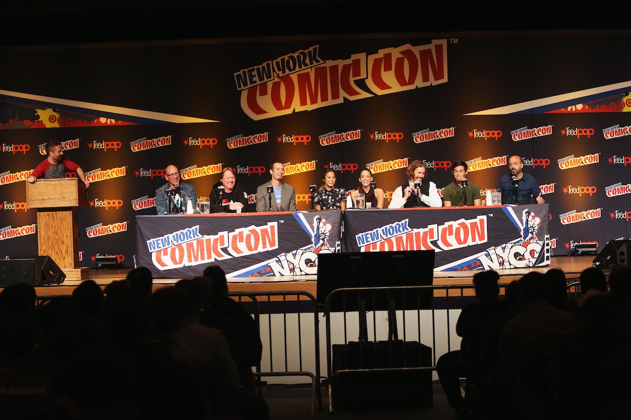 NEW YORK, NY - OCTOBER 09:  (L-R) Panel host Chris Hardwick, producer Roy Conli, director Don Hall, director Chris Williams, and actors Jamie Chung, Genesis Rodriguez, T.J. Miller, Ryan Potter, and Scott Adsit attend Walt Disney Studios' 2014 New York Comic Con presentation of "Big Hero 6" at the Javits Convention Center on Thursday October 9, 2014 in New York City.  (Photo by Jason Carter Rinaldi/Getty Images for Disney) *** Local Caption *** Chris Hardwick;Roy Conli;Don Hall;Chris Williams;Jamie Chung;Genesis Rodriguez;TJ Miller;Ryan Potter;Scott Adsit
