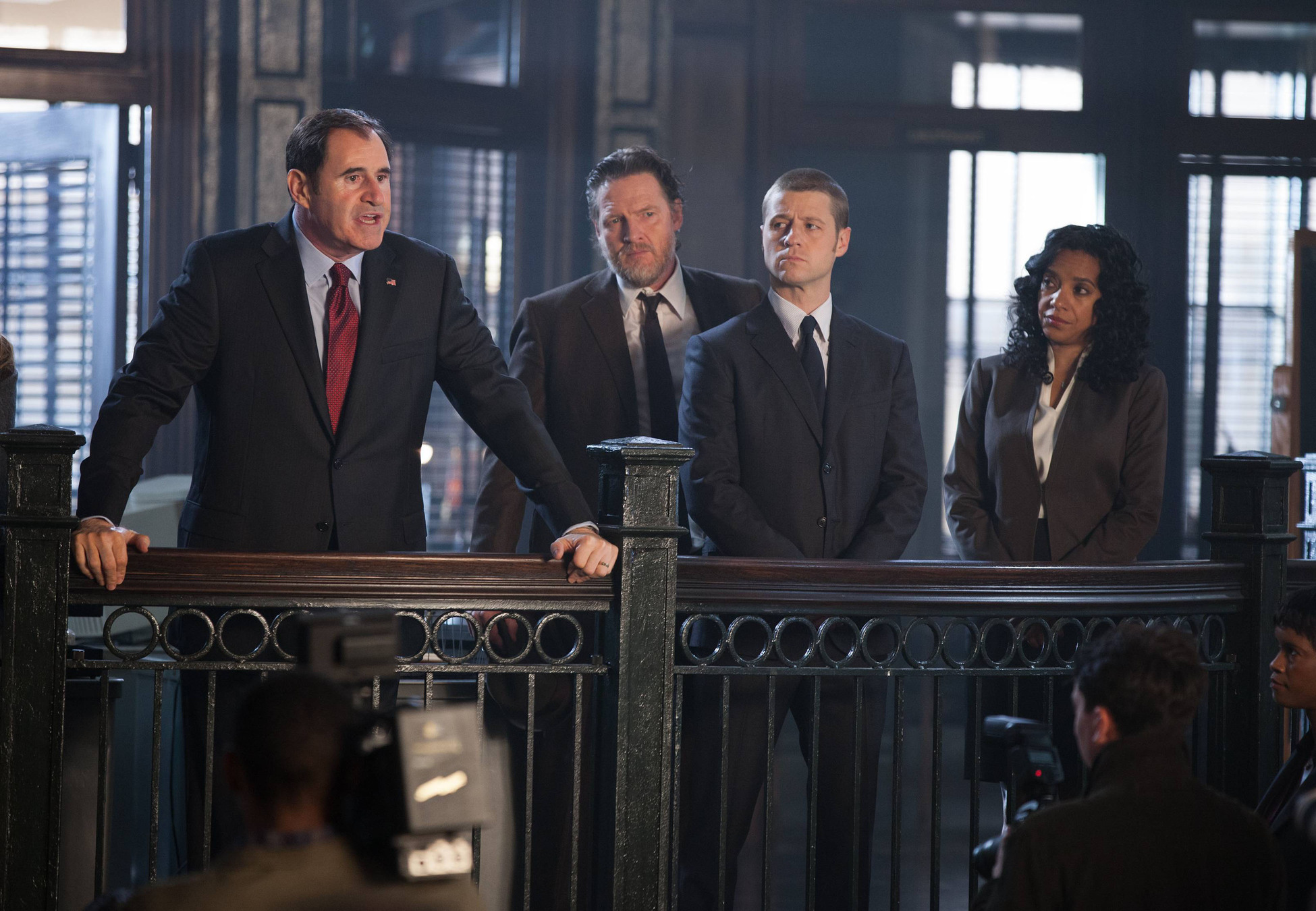 GOTHAM: Mayor James (guest star Richard Kind, L) holds a press conference after Detectives Gordon (Ben McKenzie, second from R) and Bullock (Donal Logue, second from L) apprehend child abductors in the "Selina Kyle" episode of GOTHAM airing Monday, Sept. 29 (8:00-9:00 PM ET/PT) on FOX. Also pictured: Zabryna Guevara. Â©2014 Fox Broadcasting Co. Cr: Jessica Miglio/FOX