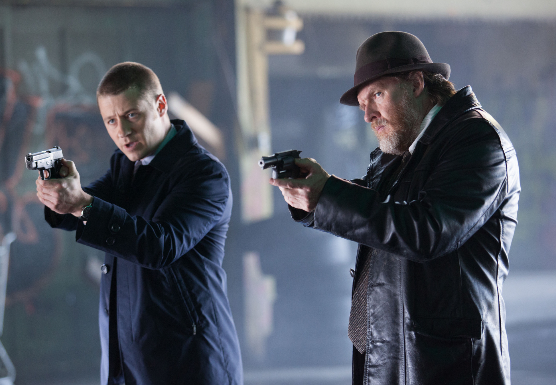GOTHAM: Detectives Gordon (Ben McKenzie, L) and Bullock (Donal Logue, R) try to detain a suspect in the "Viper" episode of GOTHAM airing Monday, Oct. 20 (8:00-9:00 PM ET/PT) on FOX. Â©2014 Fox Broadcasting Co. Cr: Jessica Miglio/FOX
