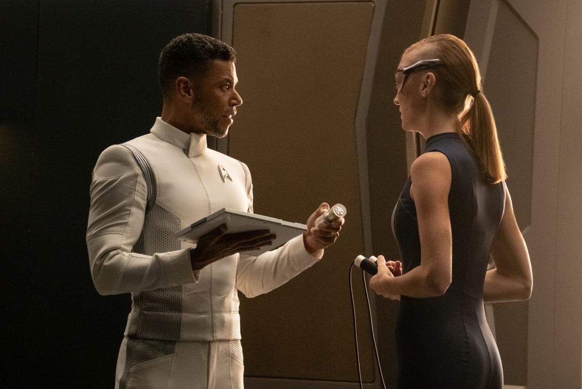 Wilson Cruz as Dr. Culber and Emily Coutts as Detmer