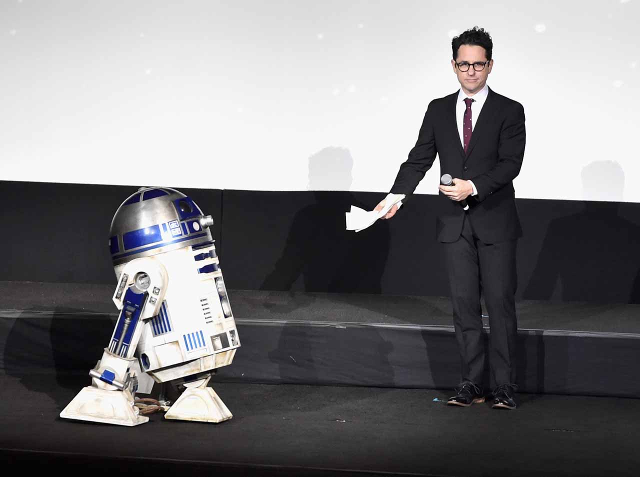 HOLLYWOOD, CA - DECEMBER 14: R2-D2 (L) and director J.J. Abrams speak onstage during the World Premiere of ?Star Wars: The Force Awakens? at the Dolby, El Capitan, and TCL Theatres on December 14, 2015 in Hollywood, California.  (Photo by Alberto E. Rodriguez/Getty Images for Disney) *** Local Caption *** R2-D2;J.J. Abrams