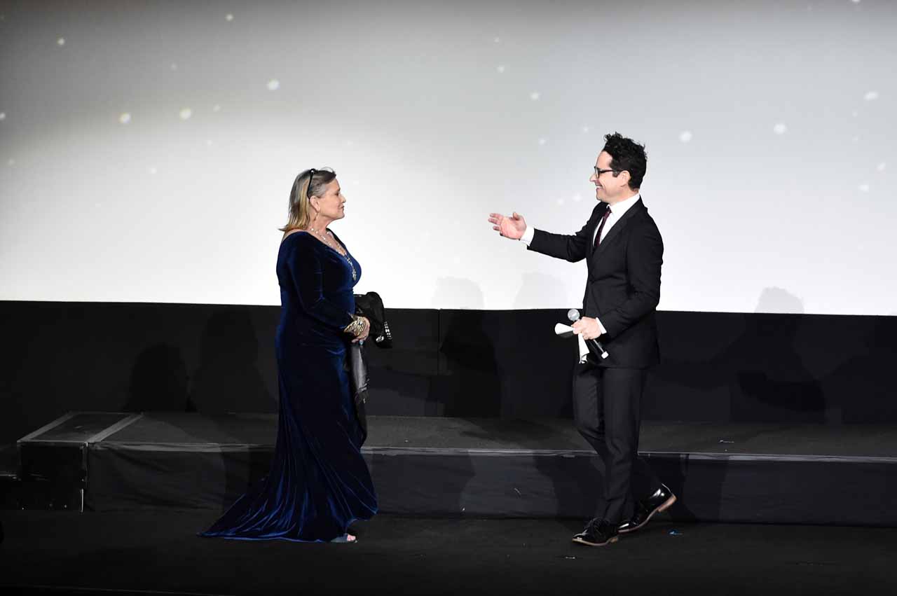 HOLLYWOOD, CA - DECEMBER 14: Actress Carrie Fisher (L) and director J.J. Abrams speak onstage during the World Premiere of ?Star Wars: The Force Awakens? at the Dolby, El Capitan, and TCL Theatres on December 14, 2015 in Hollywood, California.  (Photo by Alberto E. Rodriguez/Getty Images for Disney) *** Local Caption *** Carrie Fisher;J.J. Abrams