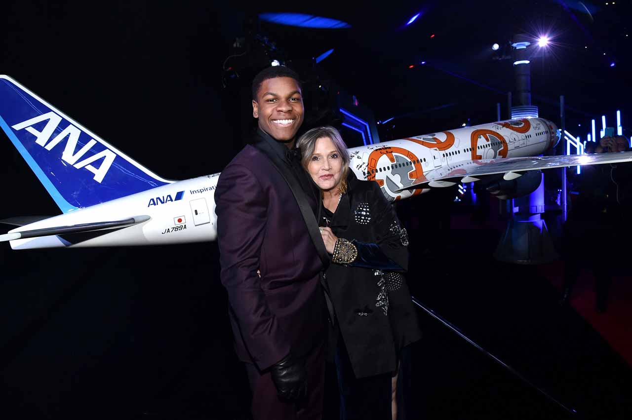 HOLLYWOOD, CA - DECEMBER 14:  Actors John Boyega (L) and Carrie Fisher attend the World Premiere of ?Star Wars: The Force Awakens? at the Dolby, El Capitan, and TCL Theatres on December 14, 2015 in Hollywood, California.  (Photo by Mike Windle/Getty Images for Disney) *** Local Caption *** John Boyega;Carrie Fisher