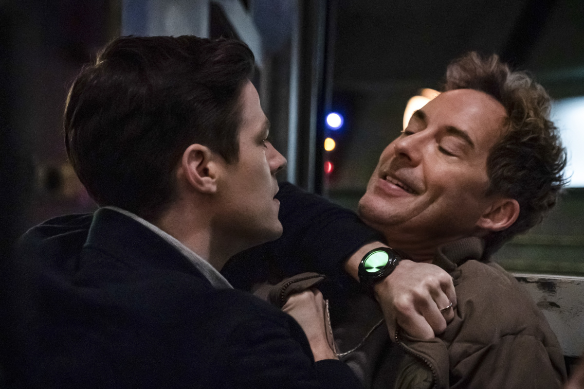 Grant Gustin as Barry Allen and Tom Cavanagh as Nash Wells